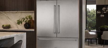 Viking Professional built-in stainless steel refrigerator installed in a modern luxury kitchen with wood cabinets, marble countertops, and ambient lighting